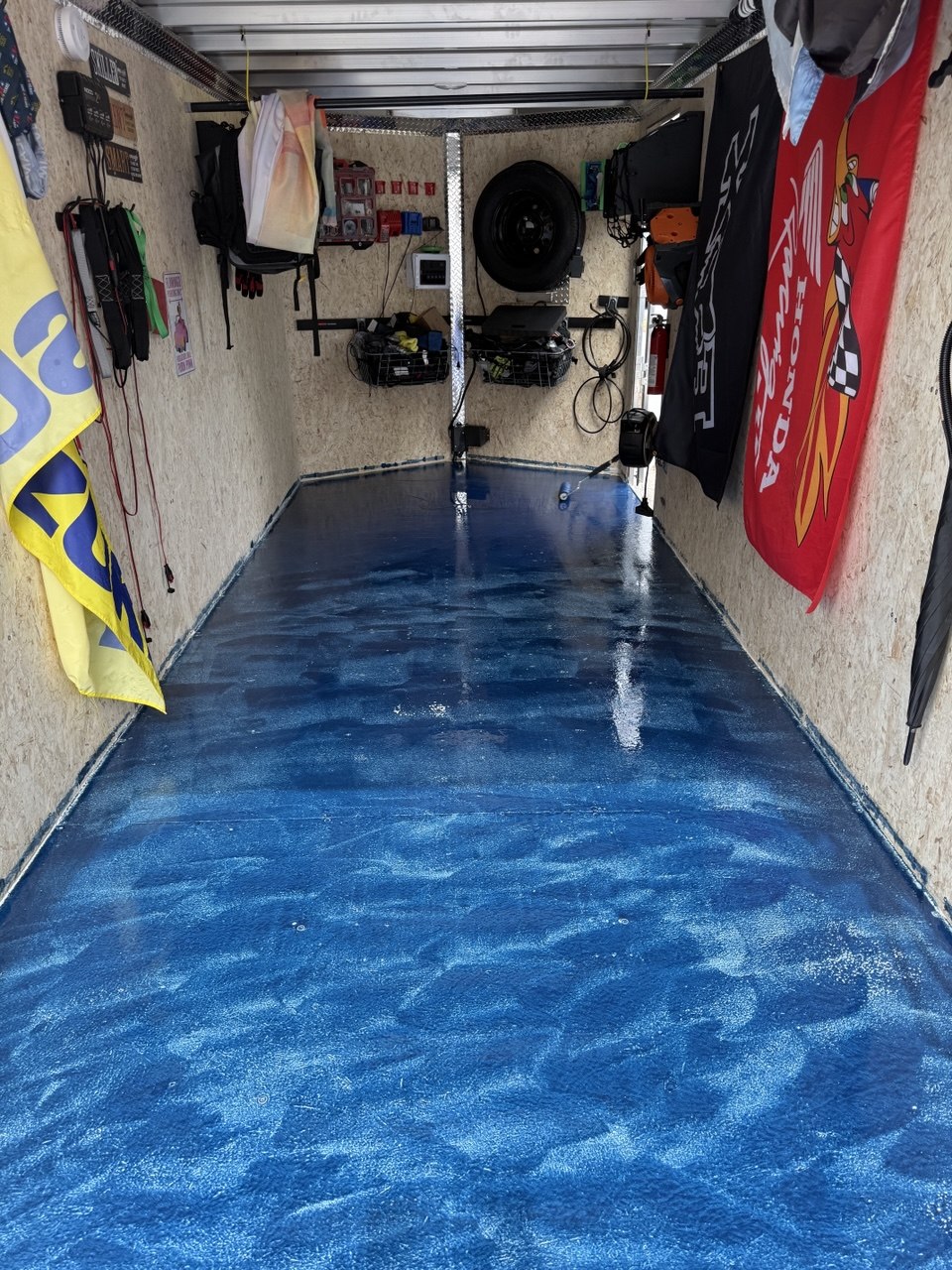 Fresh epoxy floor coating in an enclosed trailer